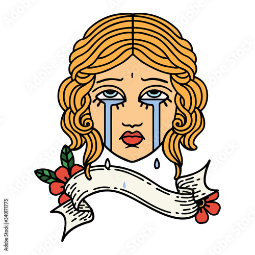 tattoo with banner of female face crying