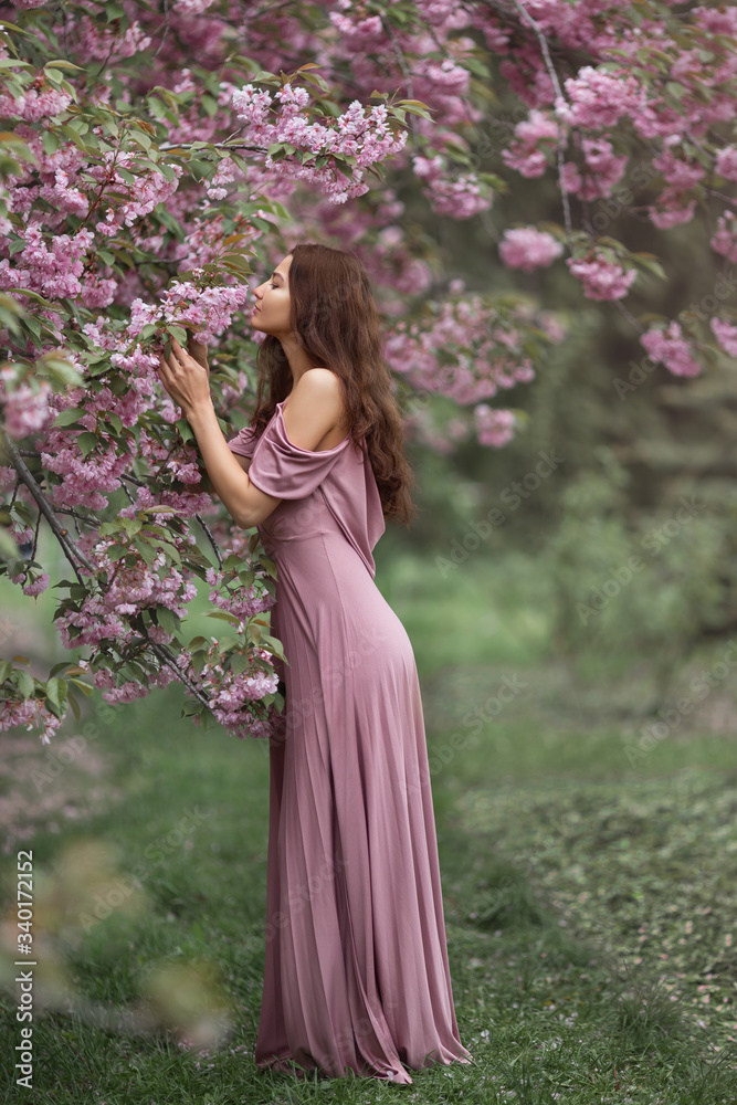 Woman at Blossoming Sakura Tree on Nature Woman at Blossoming Sakura Tree on Nature