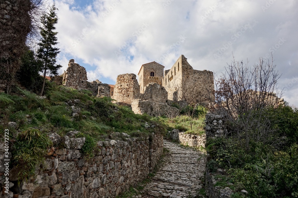 Path to Palace of Despots in Archeological site of Mystra near the Mystras, Greece during sunset
