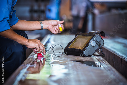 UT, Ultrasonic testing to detect imperfection or defect in welding of steel structure outside. NDT Inspection.