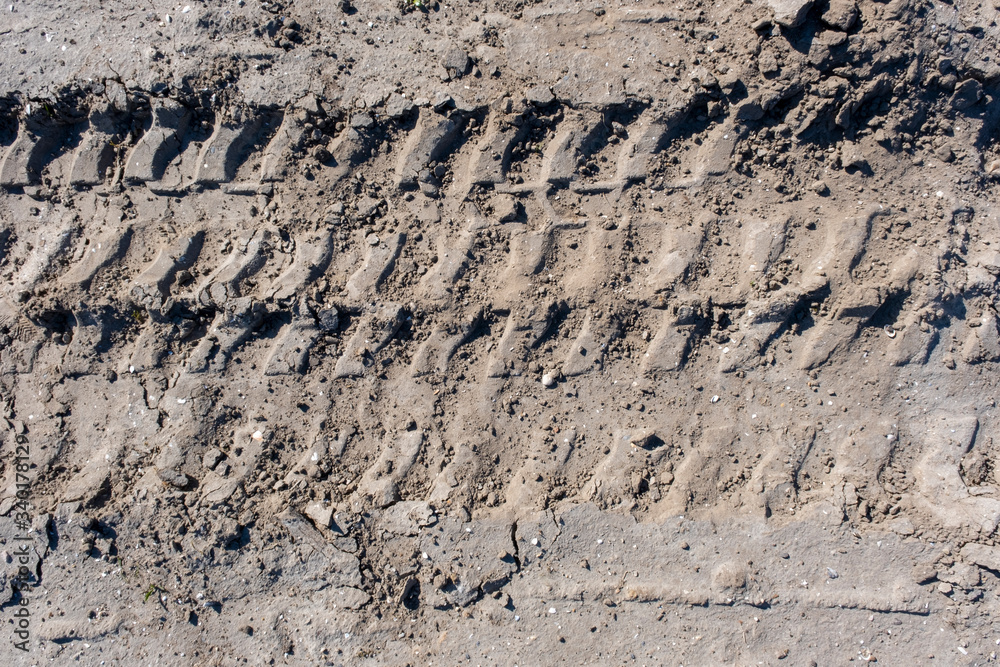 Wheel tracks in the mud, detail footprints Car Wheel tracks in the mud, detail footprints Car