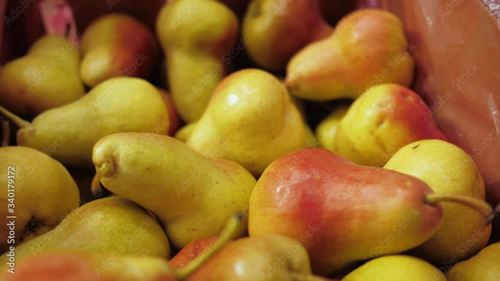 Fresh pears are on the counter of the store. Natural eco product. Close-up 4K Fresh pears are on the counter of the store. Natural eco product. Close-up 4K