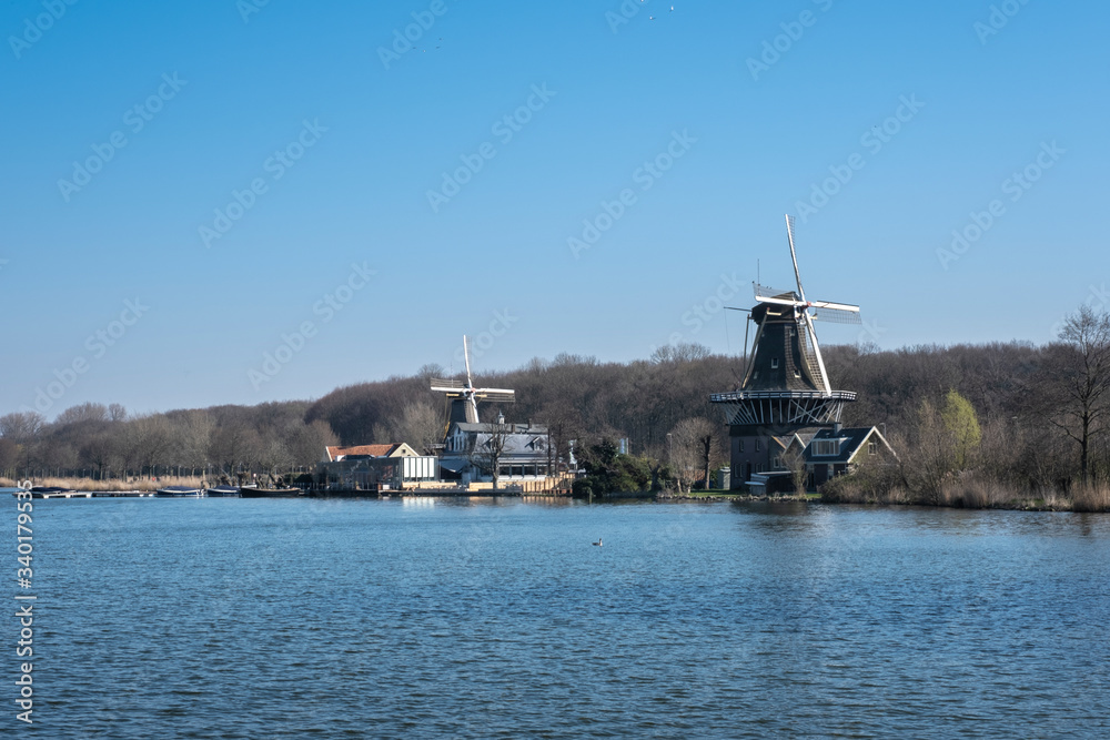 windmills on the shore of kralingse plas in rotterdam, The Netherlands