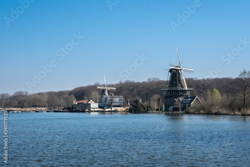 windmills on the shore of kralingse plas in rotterdam, The Netherlands