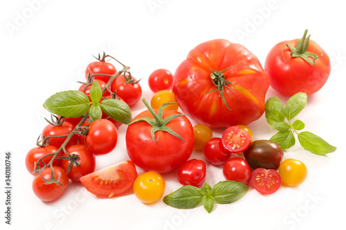 collection of colorful tomatoes and basil