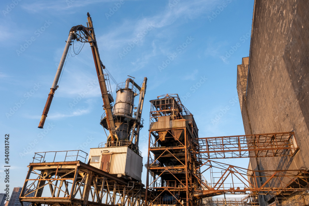 old fashion rusty Port grain elevator. Industrial sea trading port bulk cargo zone in Rotterdam harbour old fashion rusty Port grain elevator. Industrial sea trading port bulk cargo zone in Rotterdam harbour