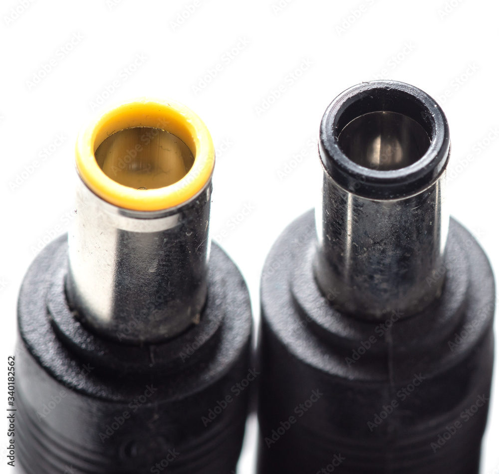 Plugs for charging a laptop on a white background Plugs for charging a laptop on a white background