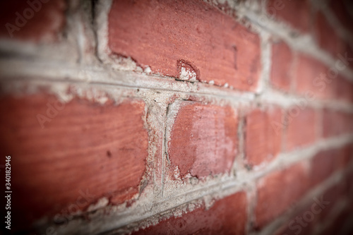 Old red bricks in the wall.