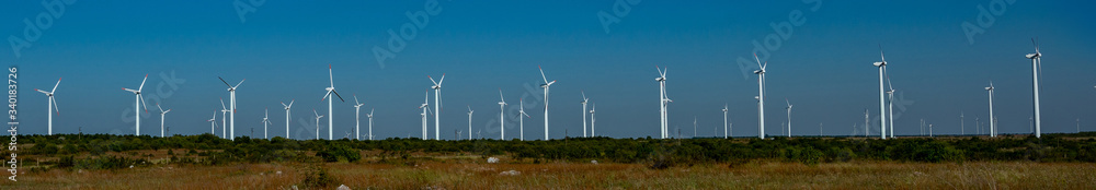 windmills on the plain in the middle of the day windmills on the plain in the middle of the day