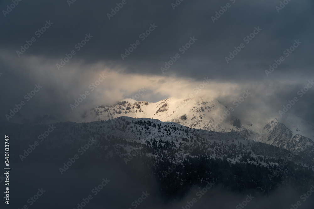 Fog revealing the Alpine mountain range, northwestern Italy