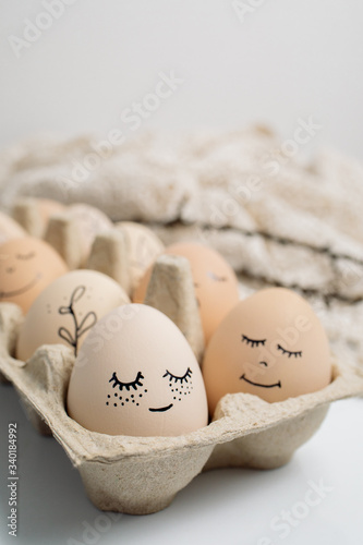 Easter eggs and easter bunny on white background with copy space. Easter background. Top view