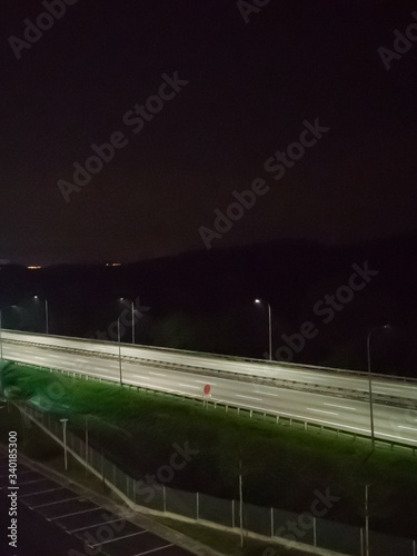 An empty North and South highway at night near the Bandar Seri Putra exit during the Movement Control Order MCO.