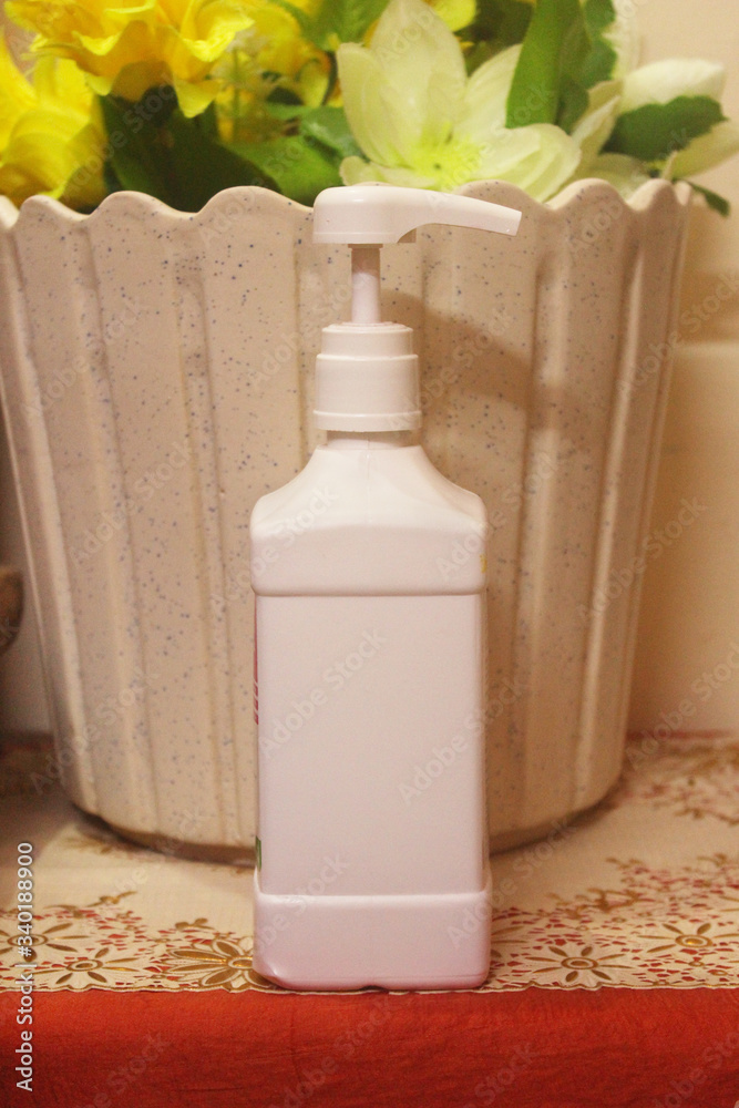 Human hand holding a hand sanitizer bottle, mockup template of antiseptic hand sanitizer bottle. Human hand holding a hand sanitizer bottle, mockup template of antiseptic hand sanitizer bottle.