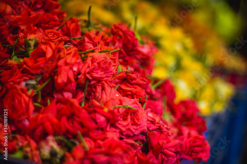 Red roses and yellow rosees in market stock photo.Beauty In Nature, Blossom, Botany, Bunch of Flowers photo