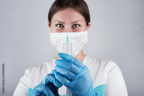 Syringe, medical injection in hand, palm or fingers. Medicine plastic vaccination equipment with needle. Nurse or doctor. Liquid drug or narcotic. Health care in hospital.