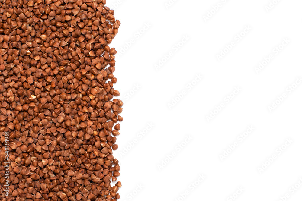 Naklejka premium Dry buckwheat isolated on white background with copy space.