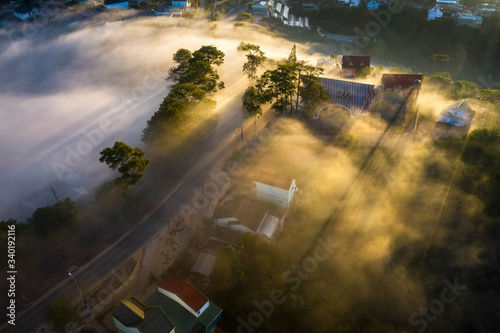 Aerial view ofroad and rooftops in the cloud and fog, at Trại Mát, Đà Lạt, Vietnam. Near provincial route 723 from Da Lat city to Nha Trang city.  
 photo