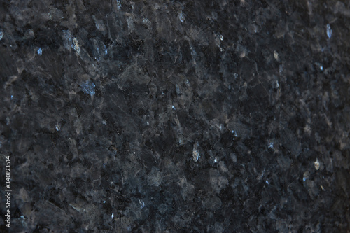 Background from gray granite with blue sparkles  this natural stone is called Blue Pearl