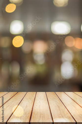 3D Rendering, Empty wooden table top with lights bokeh on blur restaurant background, Vertical