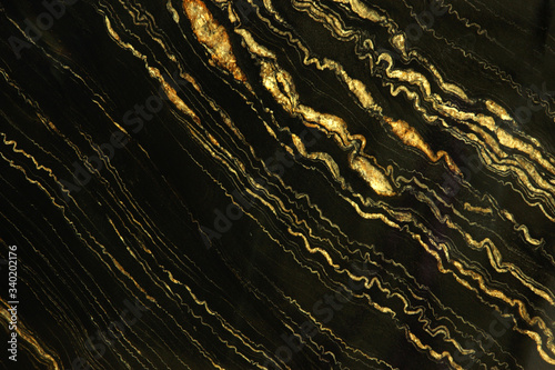 Natural stone black marble with bright yellow stripes called Quarzite Portoro Gold