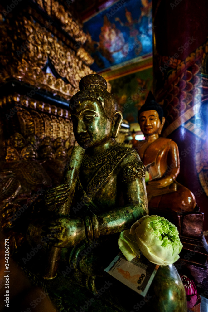 Inside and outside the Wat Phnom temple in Phnom Penh, Cambodia. Beautiful view of center in Phnom Penh, Cambodia