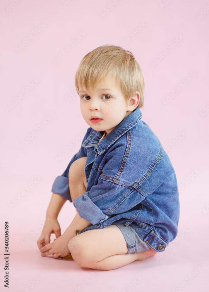 portrait of little model boy in studio