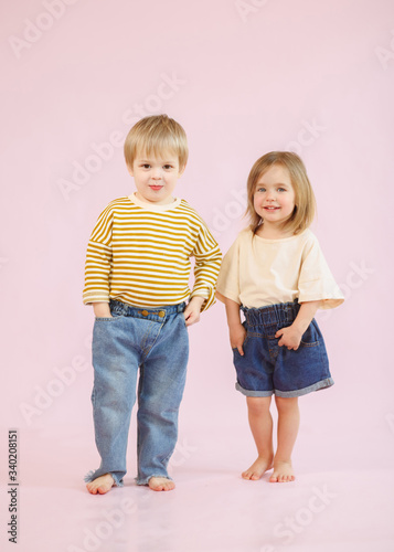 studio portrait of a boy and a girl