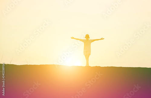 Young woman raise hands up for her success, Concept of Success in life.