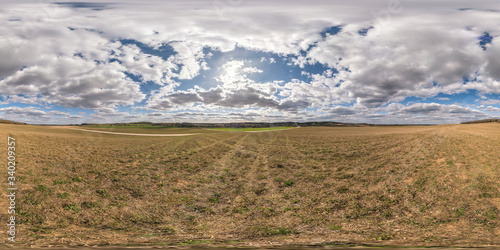 full seamless spherical hdri panorama 360 degrees angle view on among fields in spring day with awesome clouds in equirectangular projection, ready for VR AR virtual reality content