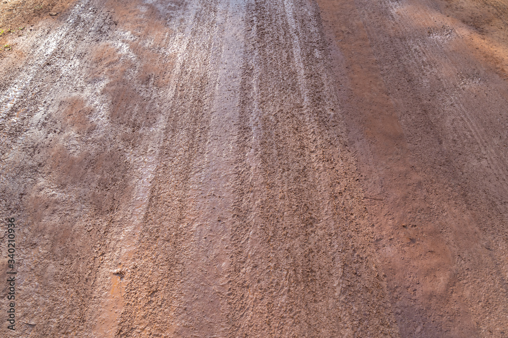 Tyre track on dirt sand or mud.