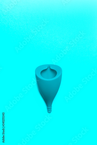 Hygiene item for womens critical days, such as menstrual cup. Alternative healthy option for womens health. Top view, flat lay, concept of womens health issues