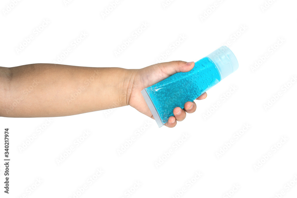 Girl's hand holding alcohol gel tube on white background.