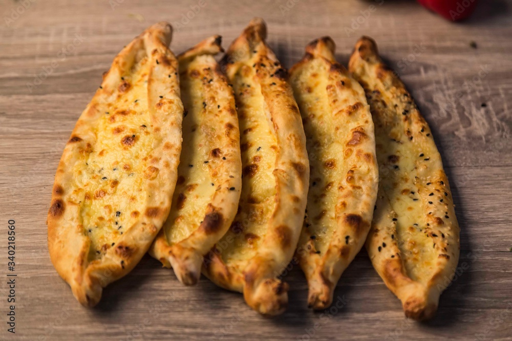 traditional cheese pita with vegetables on wooden background traditional cheese pita with vegetables on wooden background