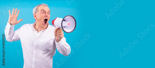 man with megaphone yelling isolated on color background