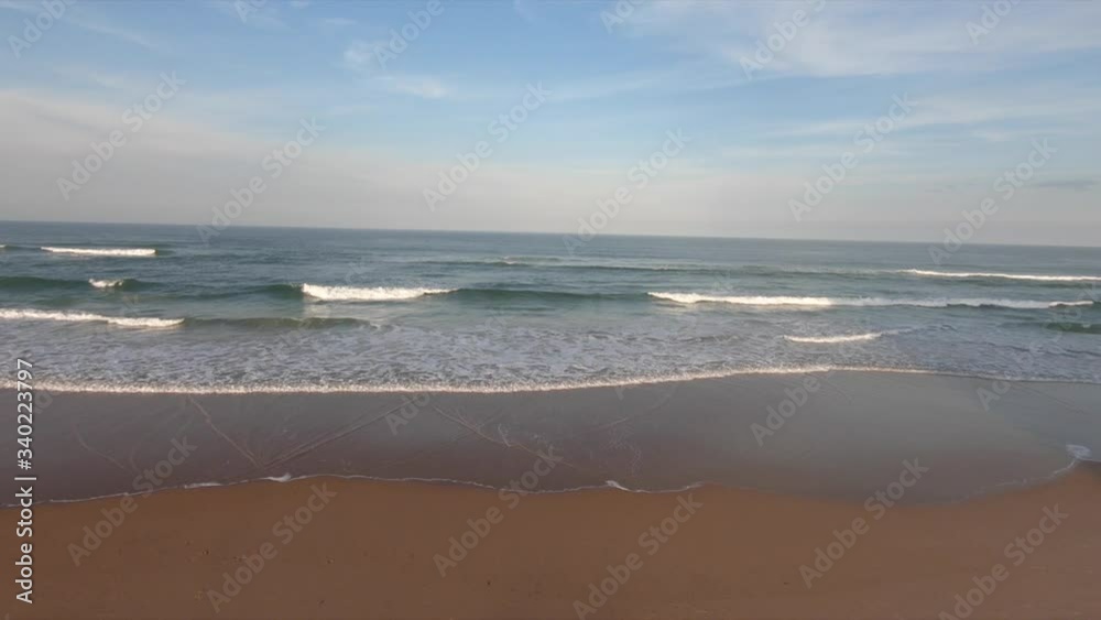 Ocean waves crashing on shore while the sun sets. Ocean waves crashing on shore while the sun sets.