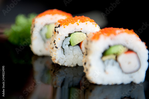 Delicious sushi on black background