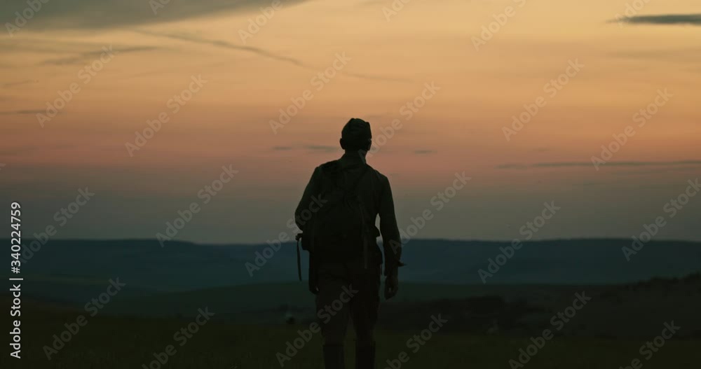 Unrecognizable soldier going to war in morning Unrecognizable soldier going to war in morning