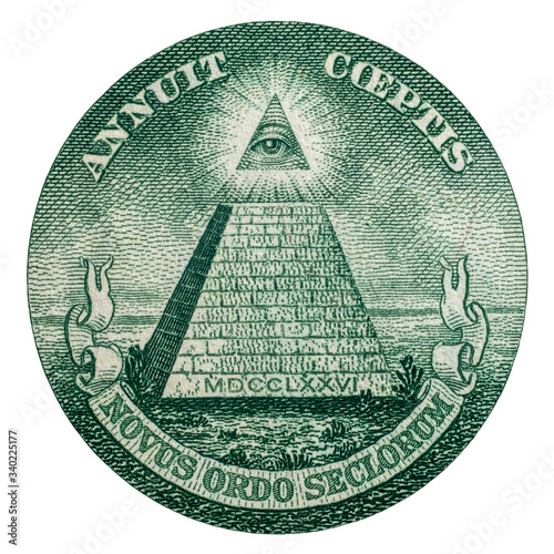 Closeup of the pyramid symbol and Annuit coeptis motto and the Eye of Providence on the one dollar. photo