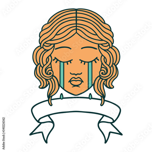 tattoo with banner of female face crying