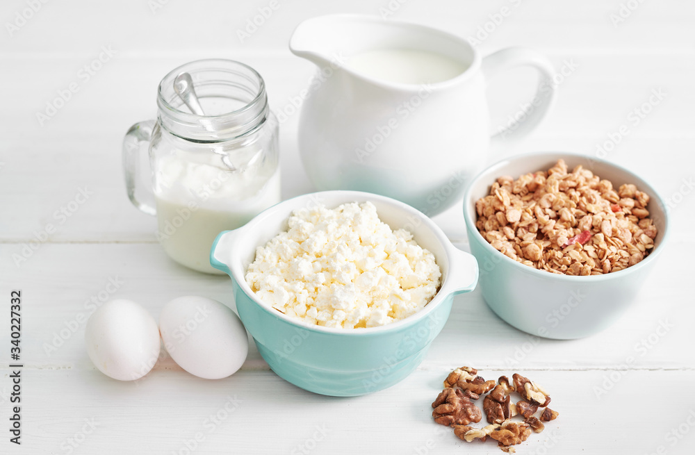 Clean eating healthy cooking ingredients. Food frame. Superfoods concept. Fitness Breakfast.Healthy eating and food, dieting, vegetarian kitchen, Cottage cheese and oatmeal with milk on table Clean eating healthy cooking ingredients. Food frame. Superfoods concept. Fitness Breakfast.Healthy eating and food, dieting, vegetarian kitchen, Cottage cheese and oatmeal with milk on table