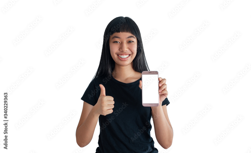 teenage girl showing her phone and doing thumbs up on white background
