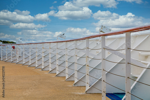 White metal bulkhead and railing at bow of cruise ship