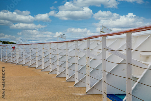 White metal bulkhead and railing at bow of cruise ship photo