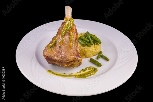 Obraz na plátně A piece of lamb on the bone garnered with sauce and mashed potatoes- restaurant