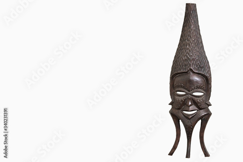A traditional wooden African Tribal Mask isolated against a white background with space for Copy Text to the left
