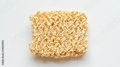 Raw egg noodles isolated on white background.