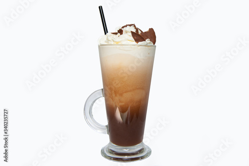 Cup of coffee in clear long glass. Isolated. Latte with ice cream and cookies and straw