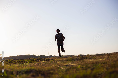 The man with runner on the street be running for exercise. © chaunpis