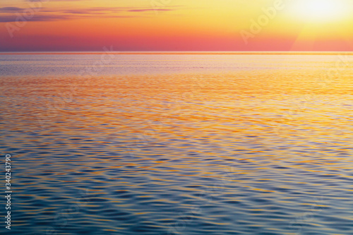 scenic ocean landscape, golden sunset or sunrise at sea © zakalinka