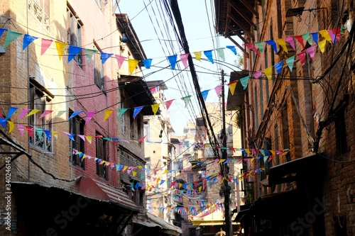 A lot of colorful prayer flags over street in Bhaktapur, Kathmandu Valley, Nepal, Asia © Iwona
